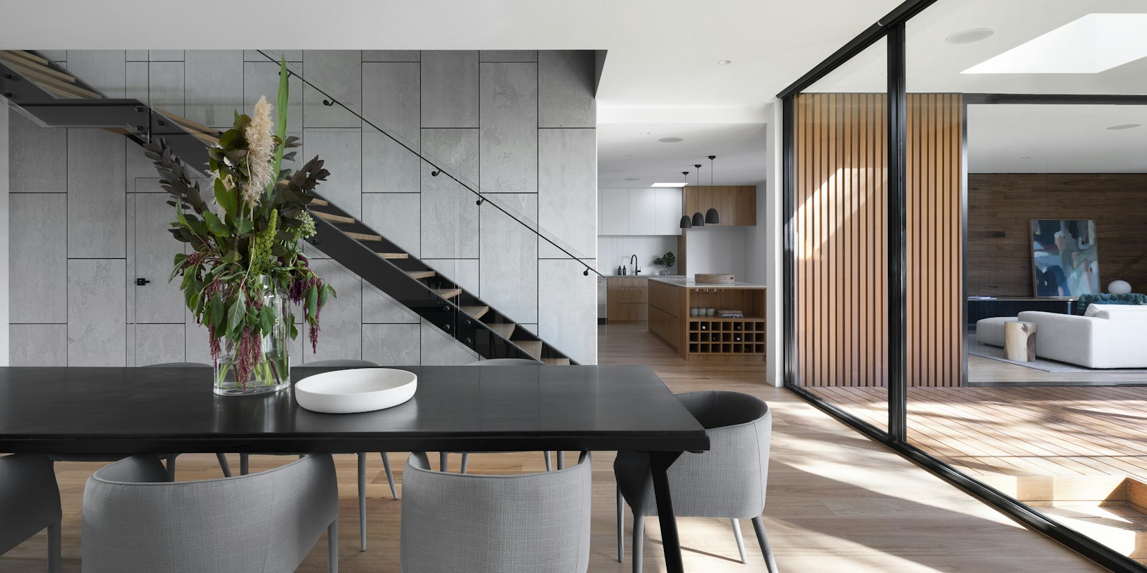 Pendant light suspended over a dining and living area